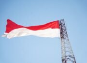 Pangdam XIII/Merdeka Nyalakan Semangat Nasionalisme Lewat Bendera 14×21 Meter